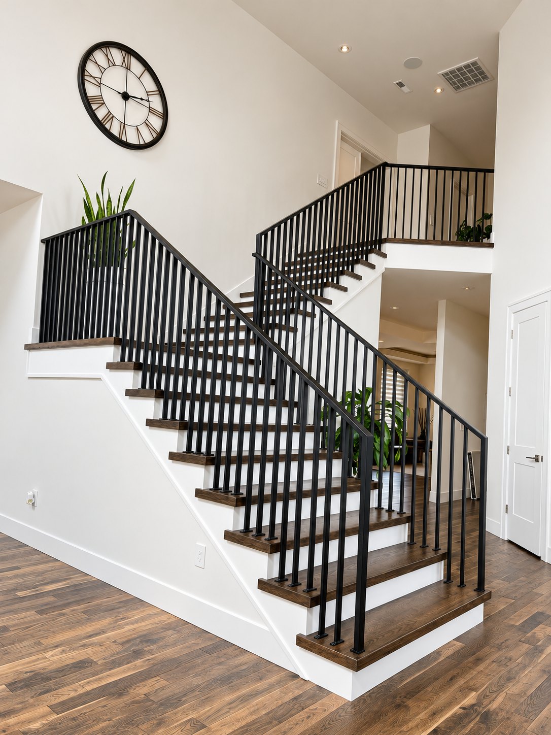 Black vertical-picket metal stair railing in a Vancouver, WA area home