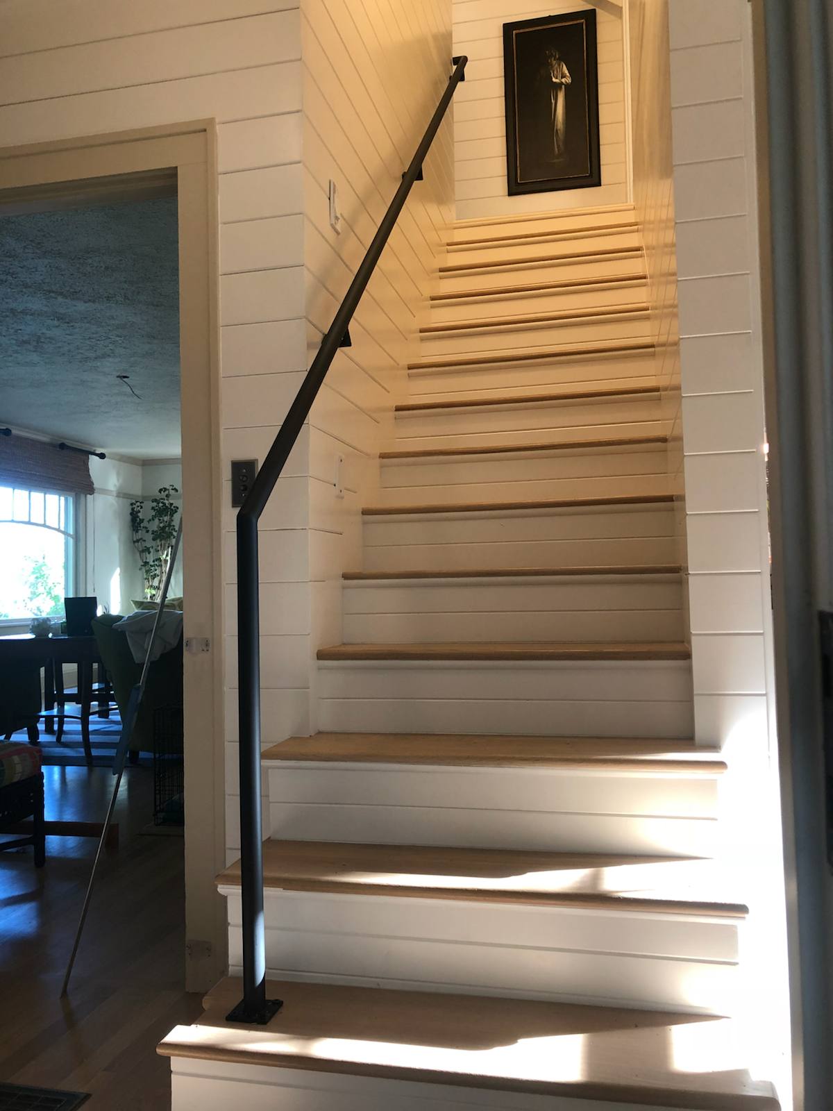 Wall-mounted black metal handrail in a Vancouver, WA area home
