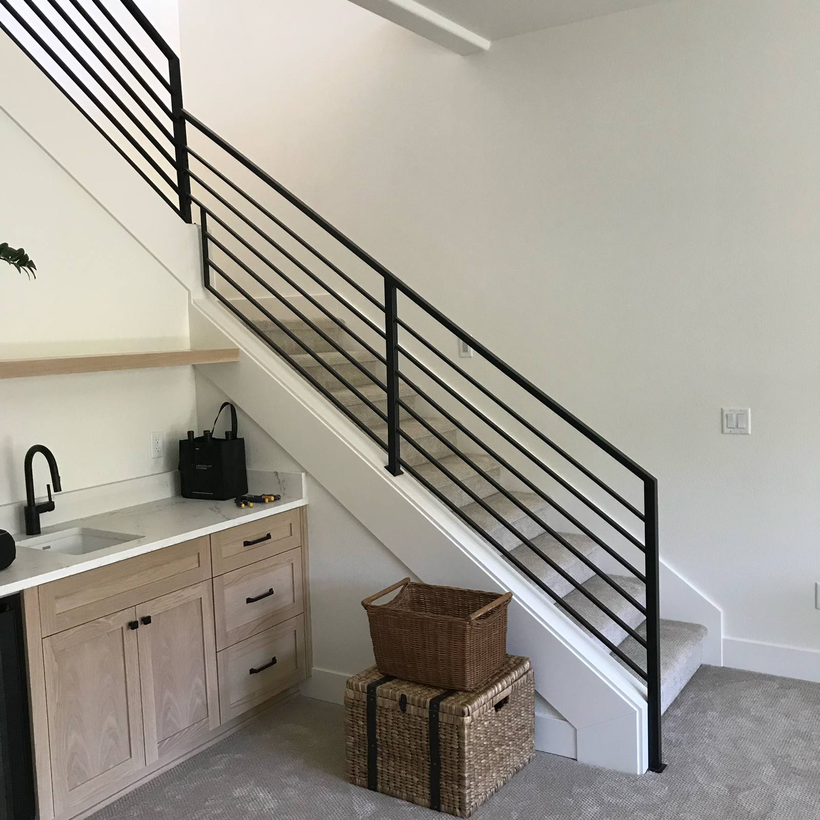 Modern horizontal-bar metal stair railing — custom built and installed in Portland, OR