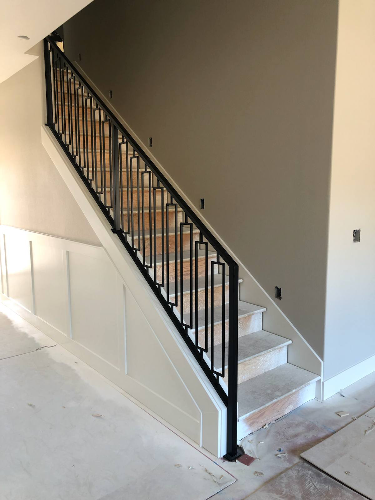 Black vertical-picket metal stair railing — custom metal railing, Portland