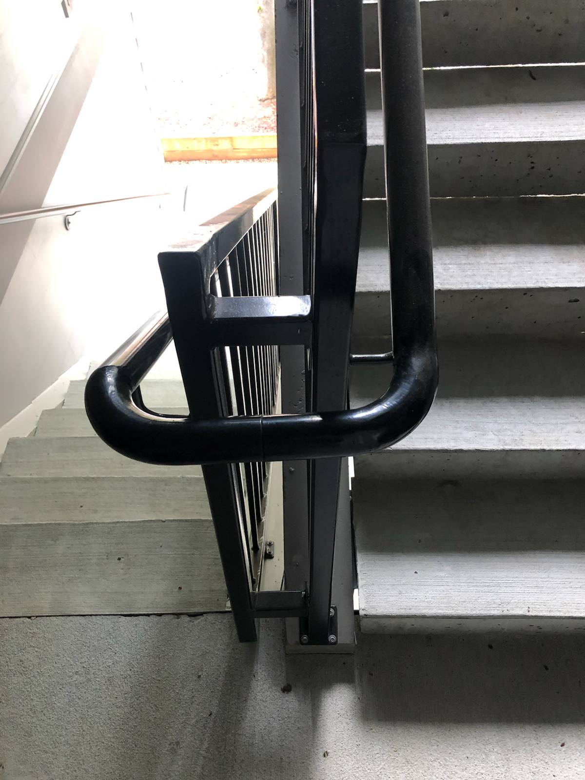 Close-up of a custom welded metal handrail by Cascade Mobile Welding