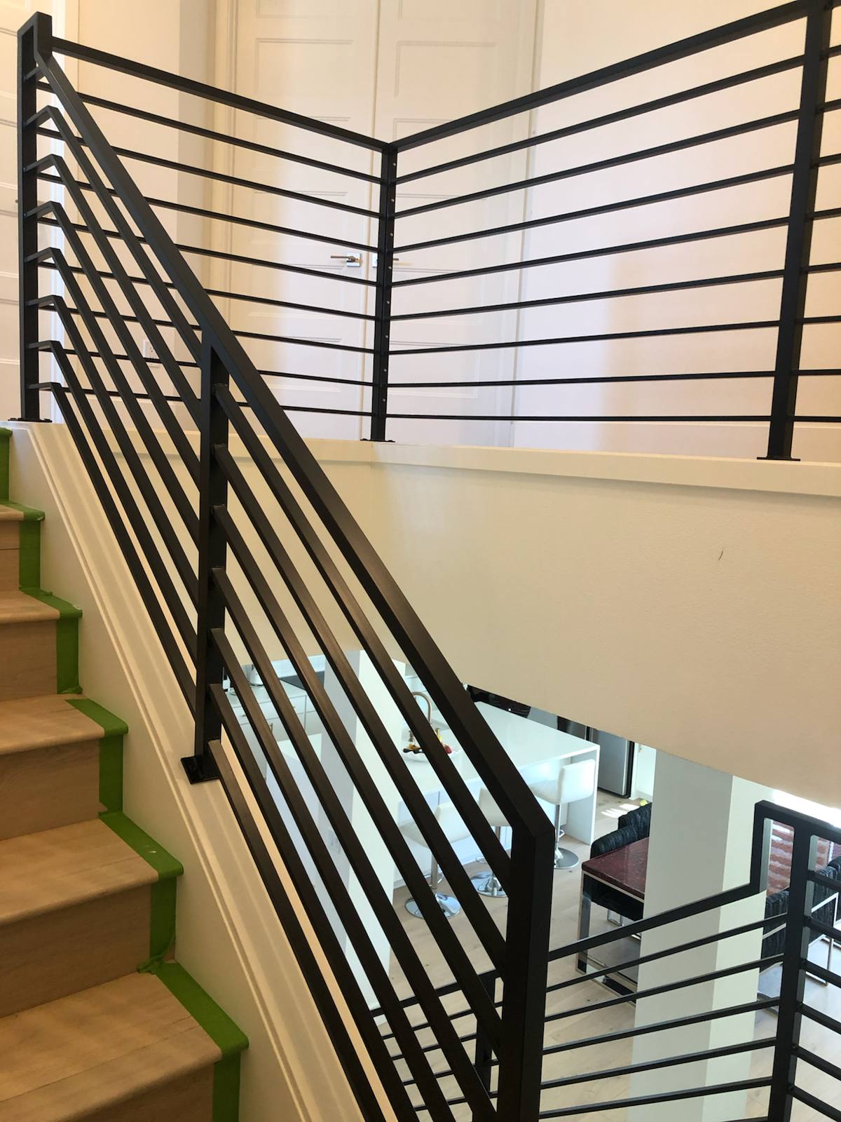 Modern horizontal-bar metal stair railing — custom metal railing, Portland