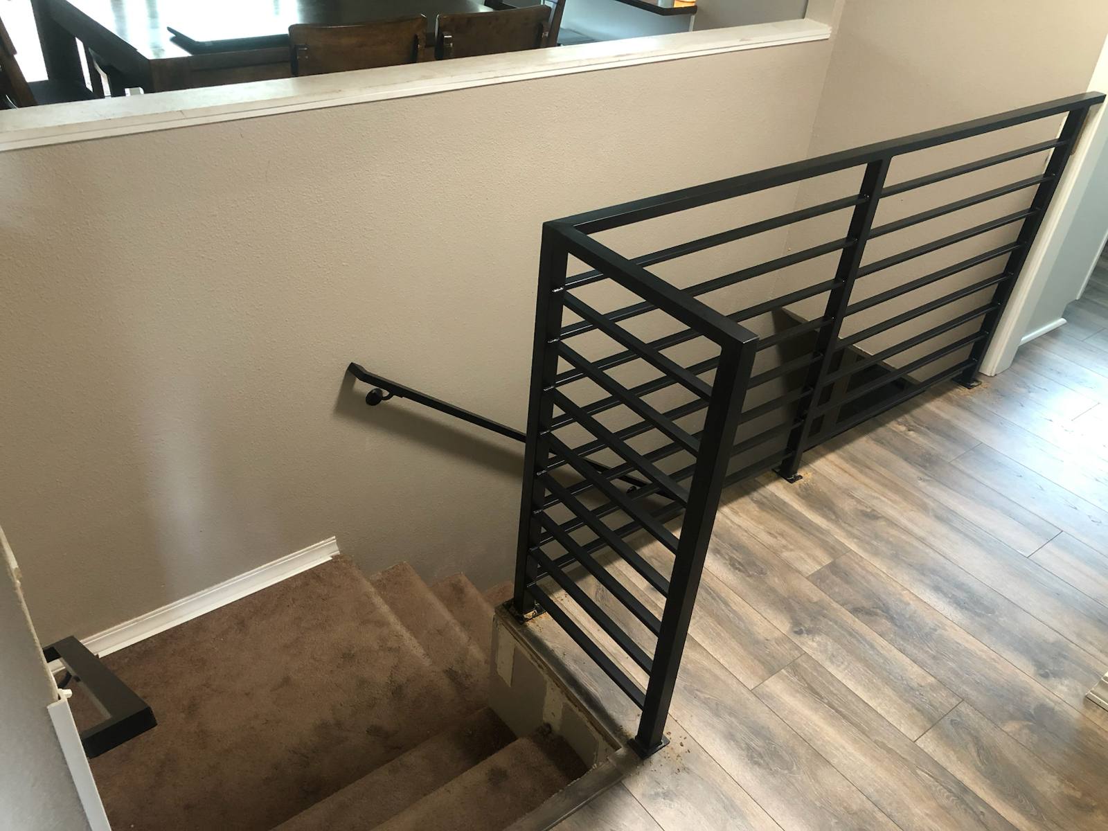 Modern horizontal-bar metal stair railing — measured, welded and installed on site