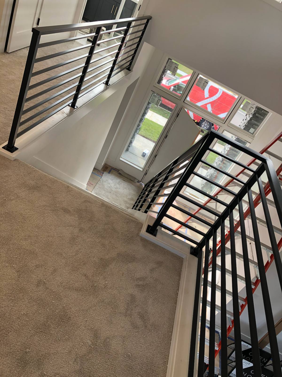 Modern horizontal-bar metal stair railing — custom metal railing, Portland