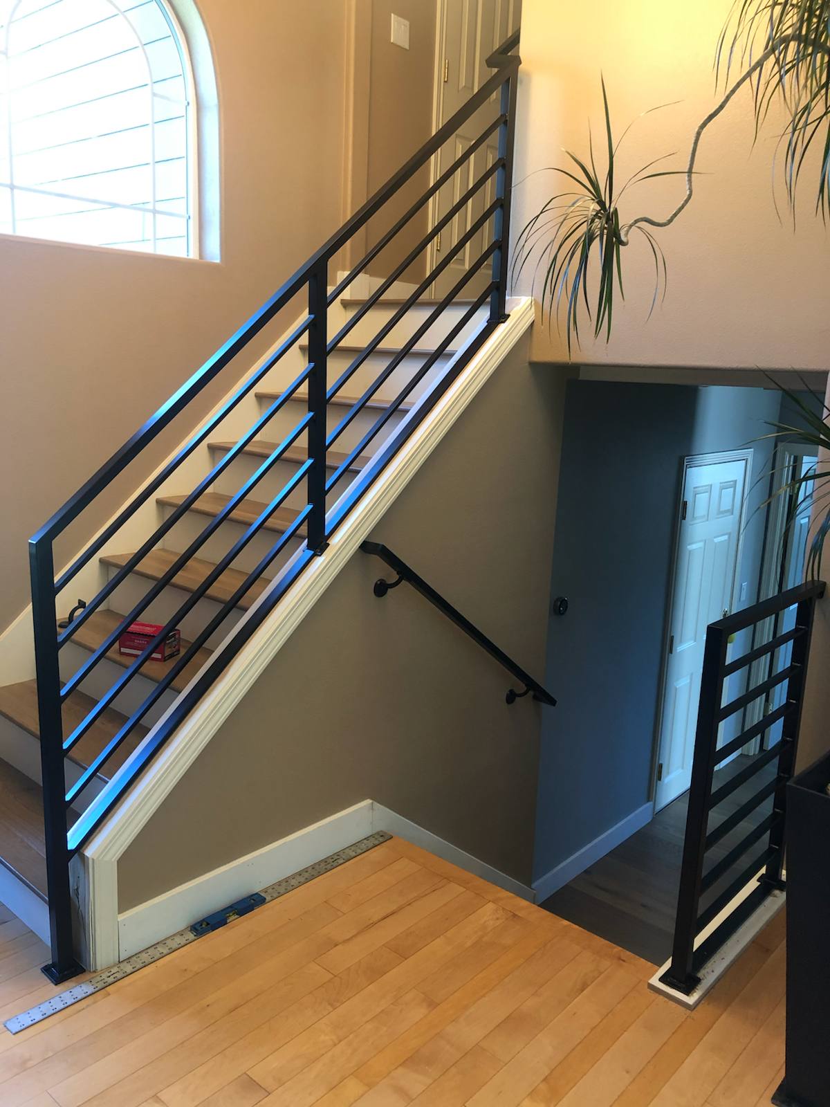 Modern horizontal-bar metal stair railing — measured, welded and installed on site