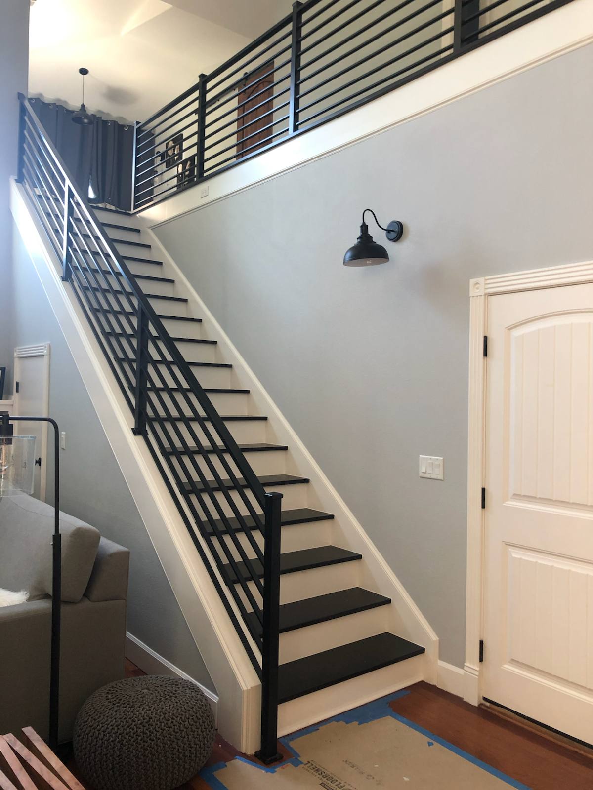 Black vertical-picket metal stair railing — custom metal railing, Portland
