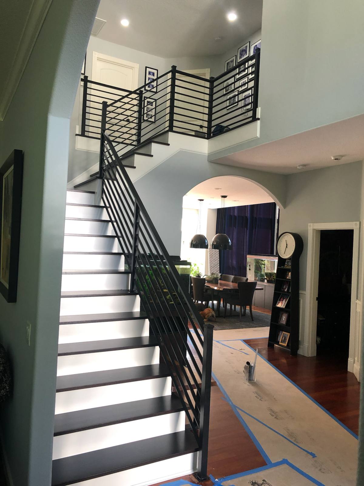 Black vertical-picket metal stair railing — custom built and installed in Portland, OR