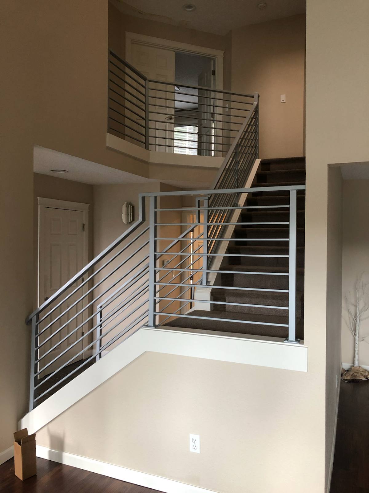 Modern horizontal-bar metal stair railing — measured, welded and installed on site