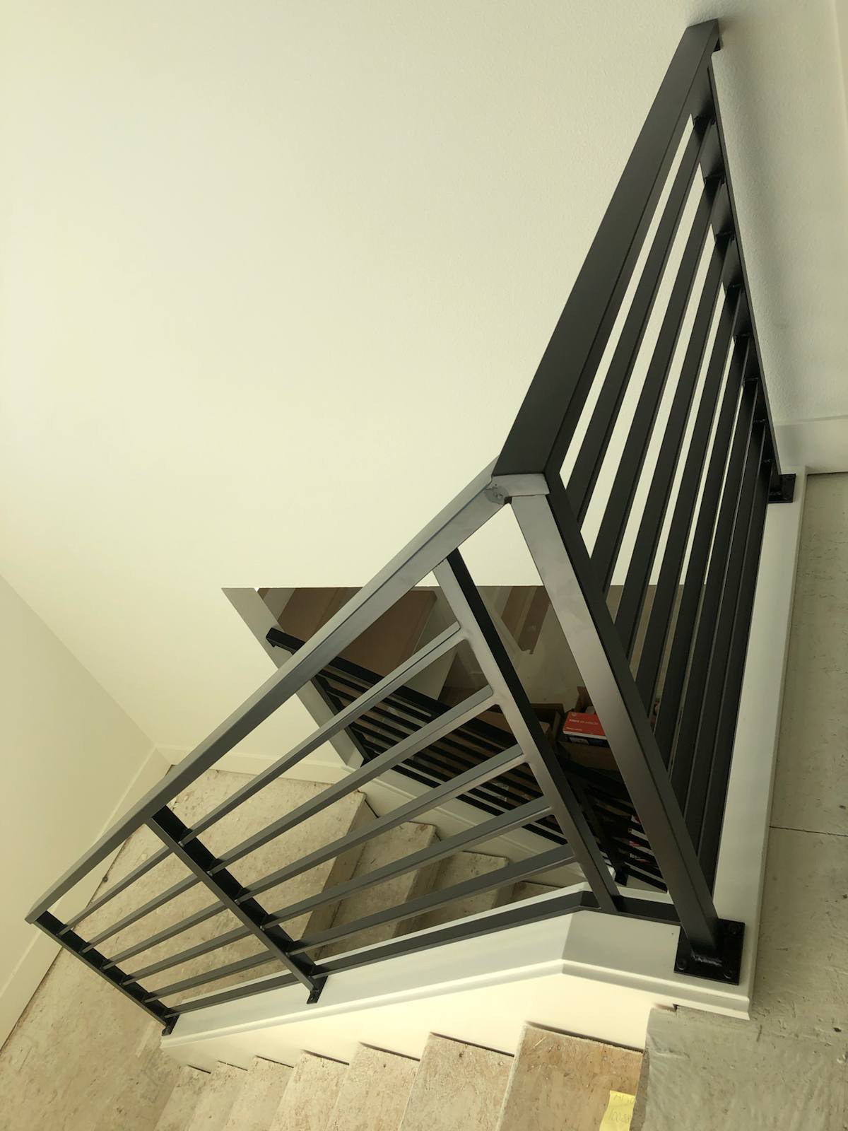Modern horizontal-bar metal stair railing in a Vancouver, WA area home