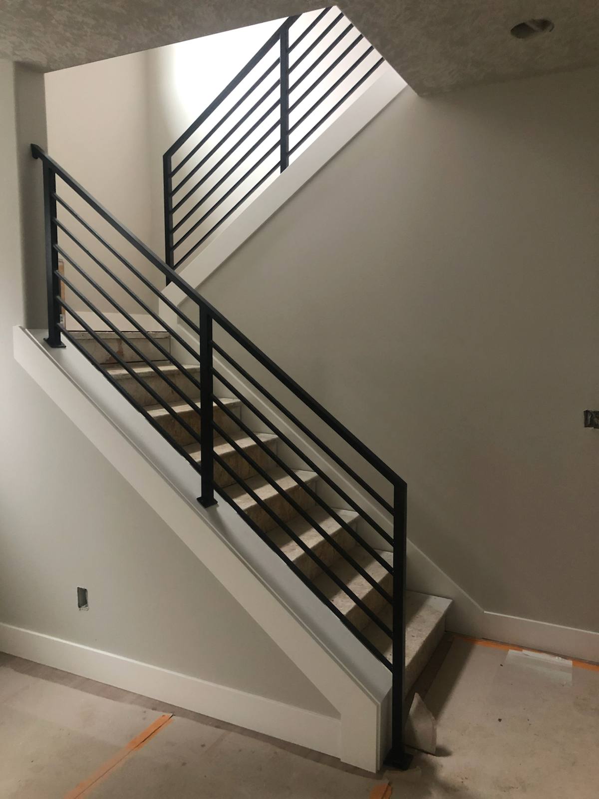 Modern horizontal-bar metal stair railing — custom metal railing, Portland