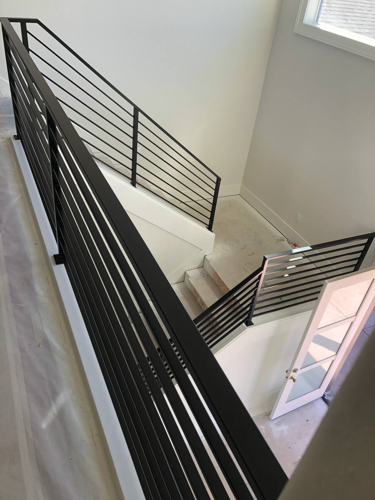 Modern horizontal-bar metal stair railing — custom metal railing, Portland