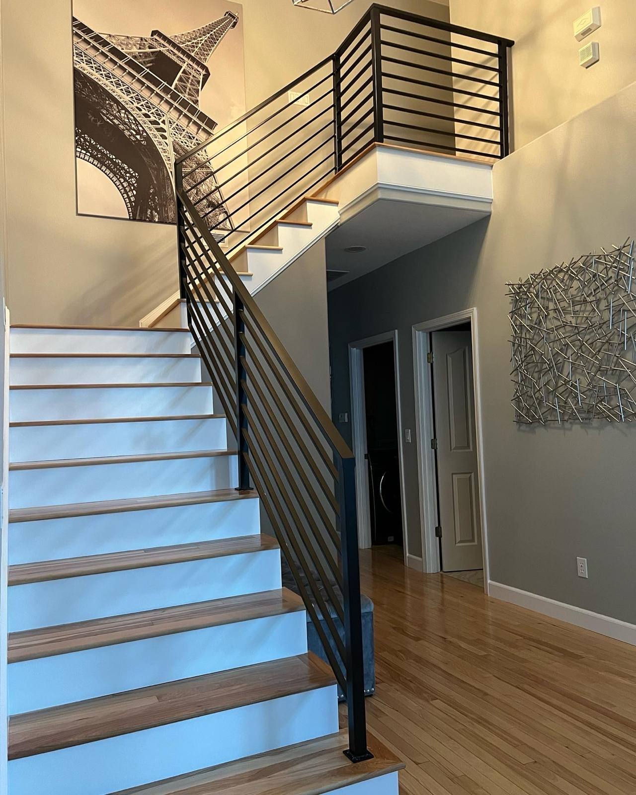Black vertical-picket metal stair railing in a Vancouver, WA area home