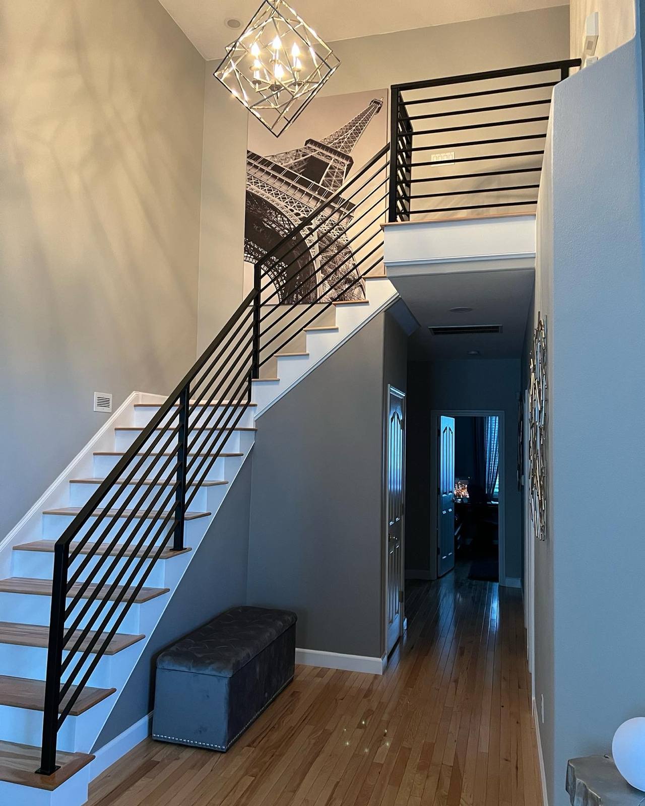 Black vertical-picket metal stair railing — custom metal railing, Portland