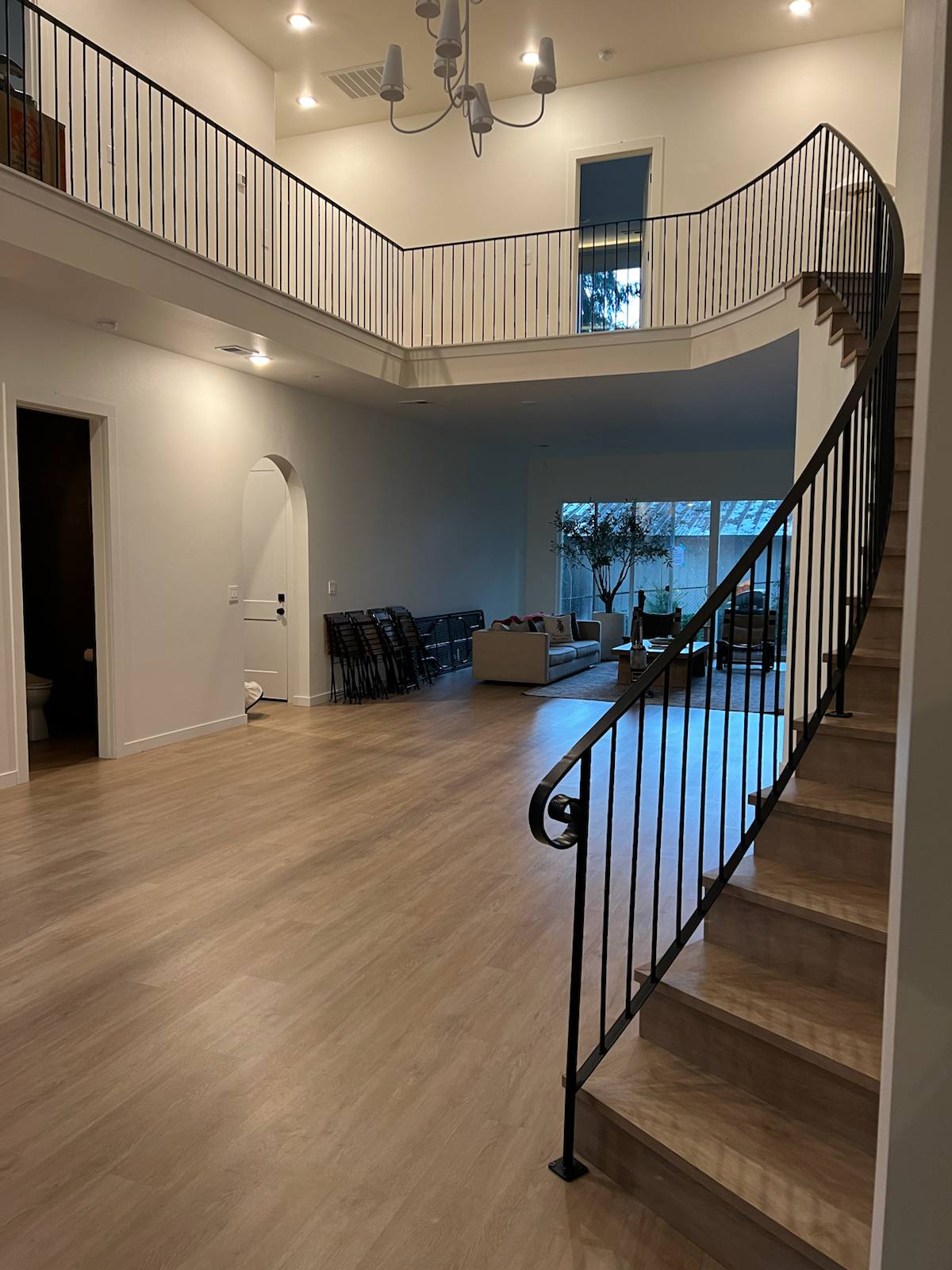 Curved custom metal staircase railing by Cascade Mobile Welding