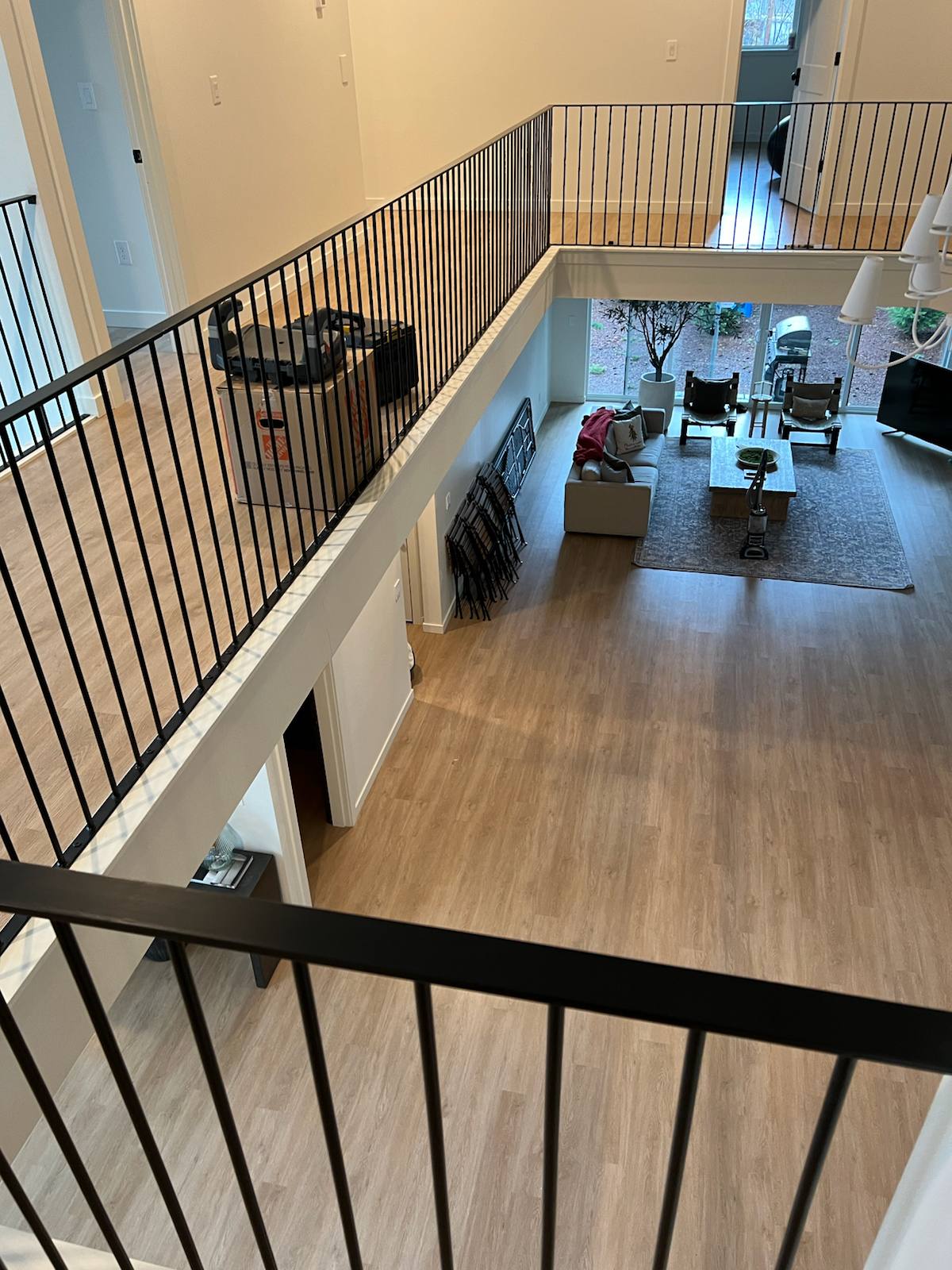 Black vertical-picket metal stair railing — custom built and installed in Portland, OR
