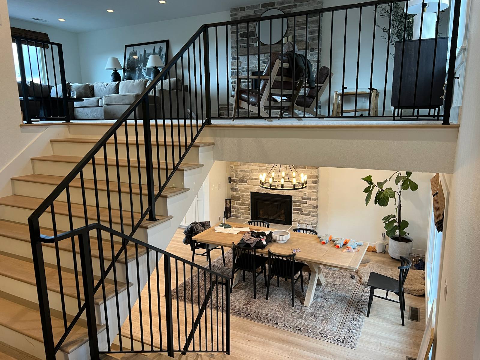 Black vertical-picket metal stair railing in a Portland-area home