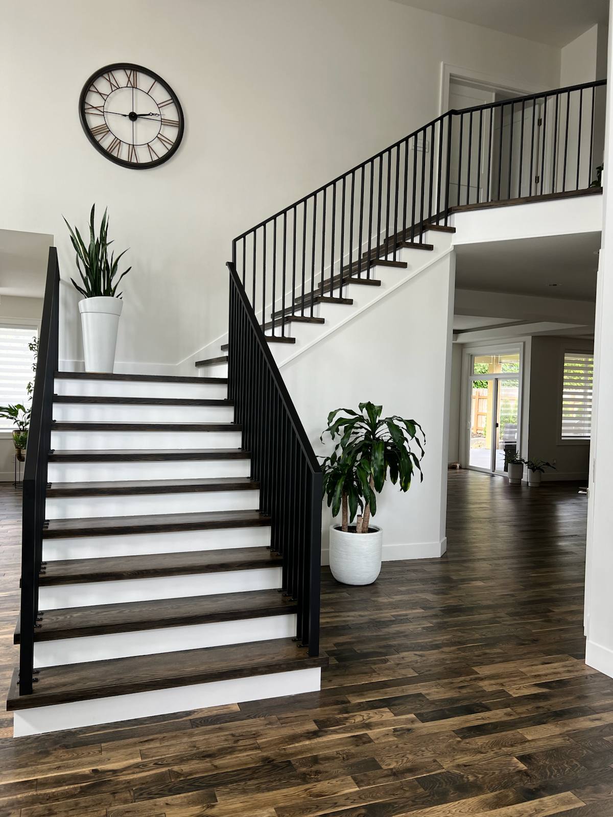 Black vertical-picket metal stair railing — custom metal railing, Portland