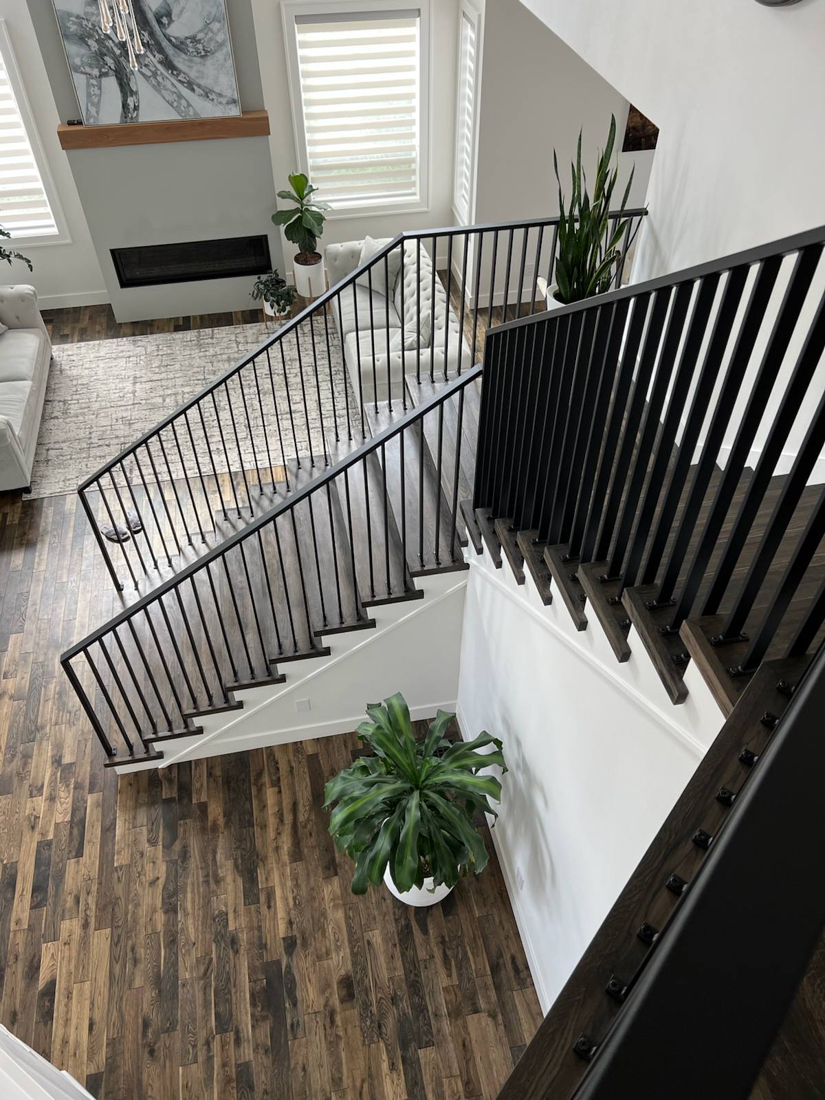 Black vertical-picket metal stair railing — custom built and installed in Portland, OR