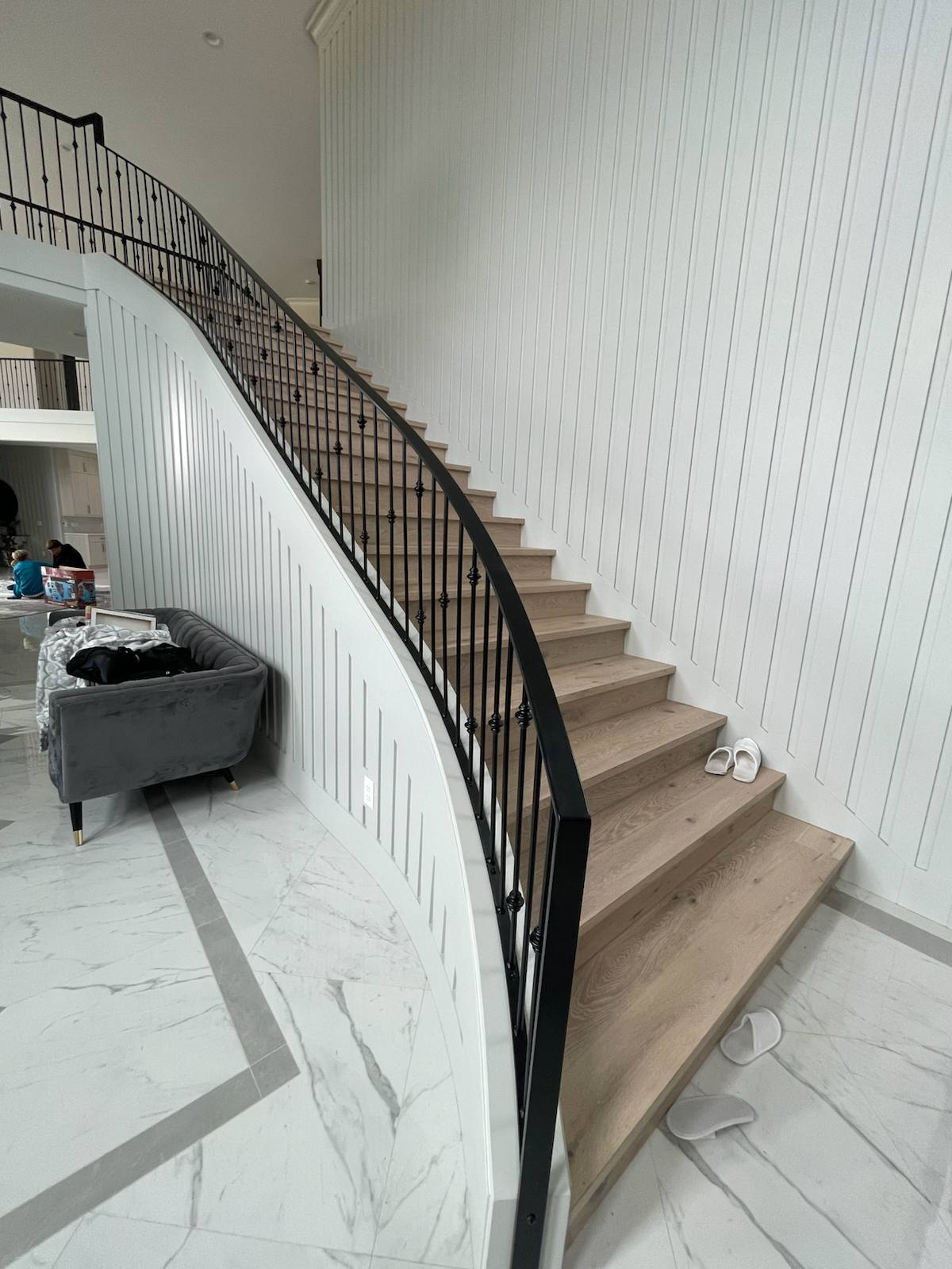Curved custom metal staircase railing — custom built and installed in Portland, OR
