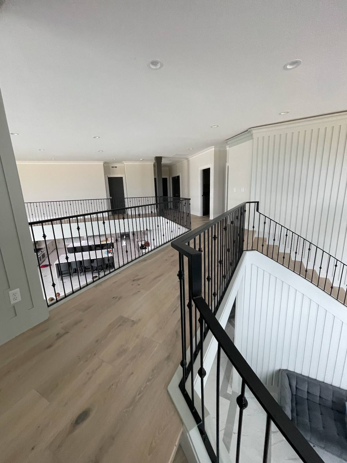 Black vertical-picket metal stair railing in a Vancouver, WA area home