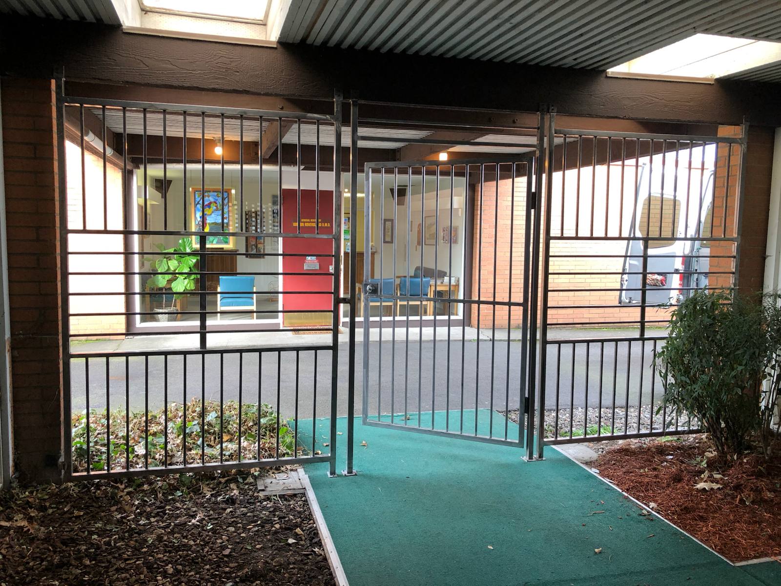 Steel security gate at a building entrance — welded and installed on site