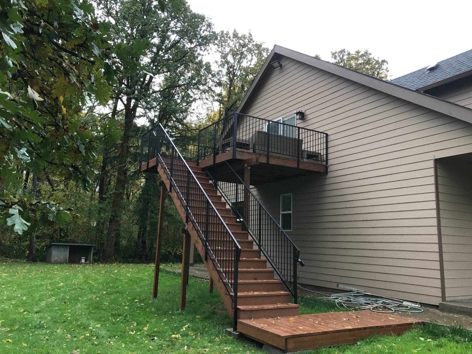 Metal railing on exterior deck stairs in a Portland-area home
