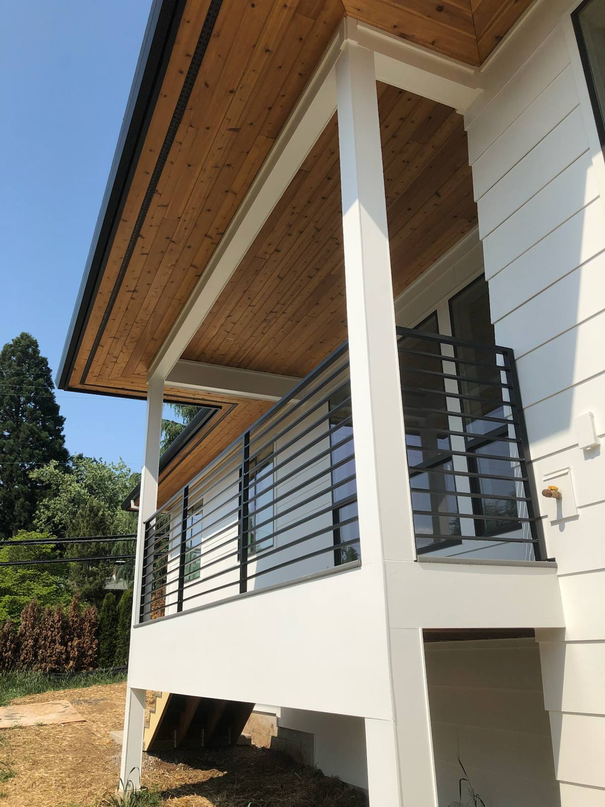 Modern metal deck railing on an elevated deck — welded and installed on site