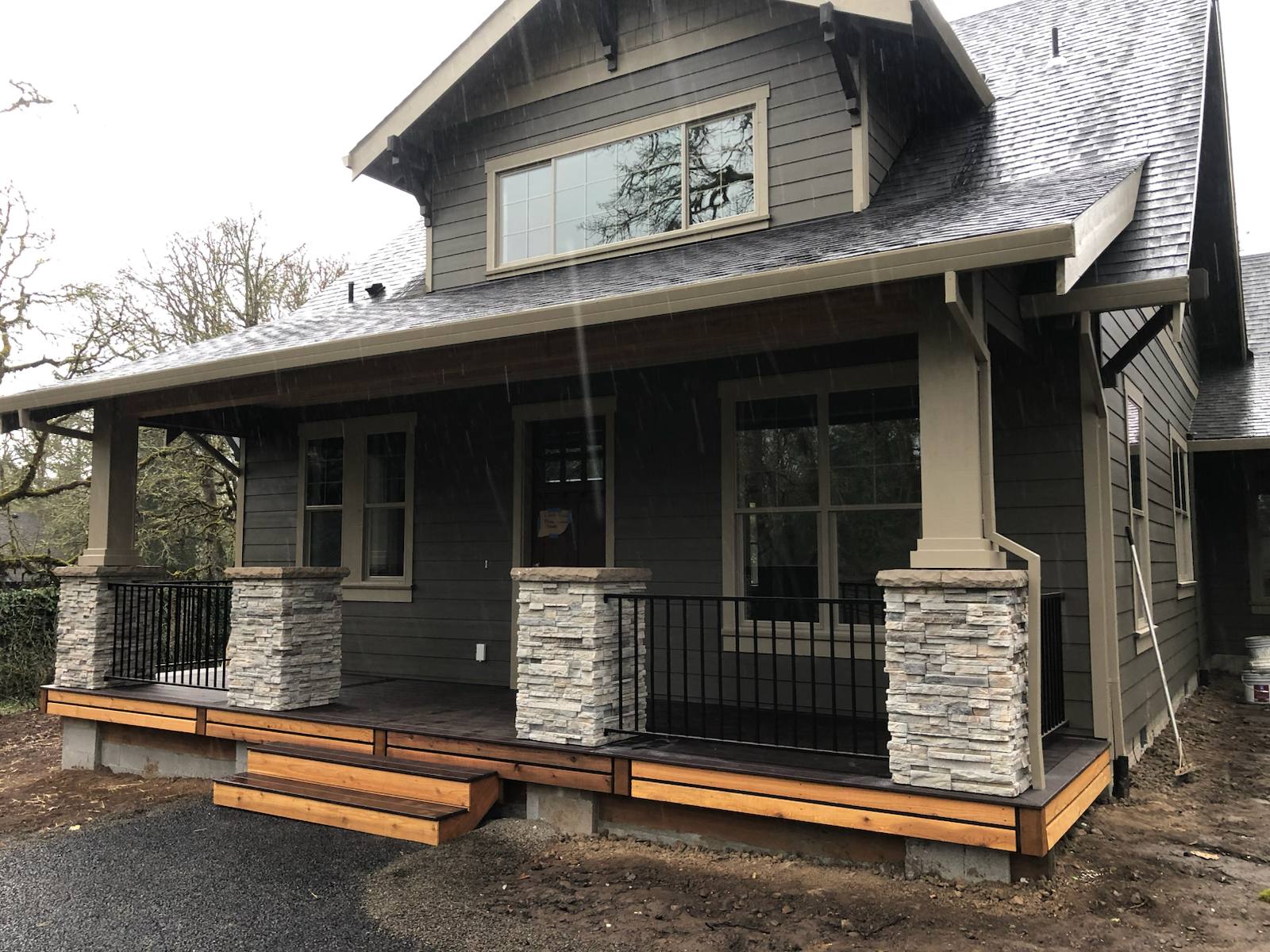 Black metal porch railing and step handrail — custom metalwork, Portland