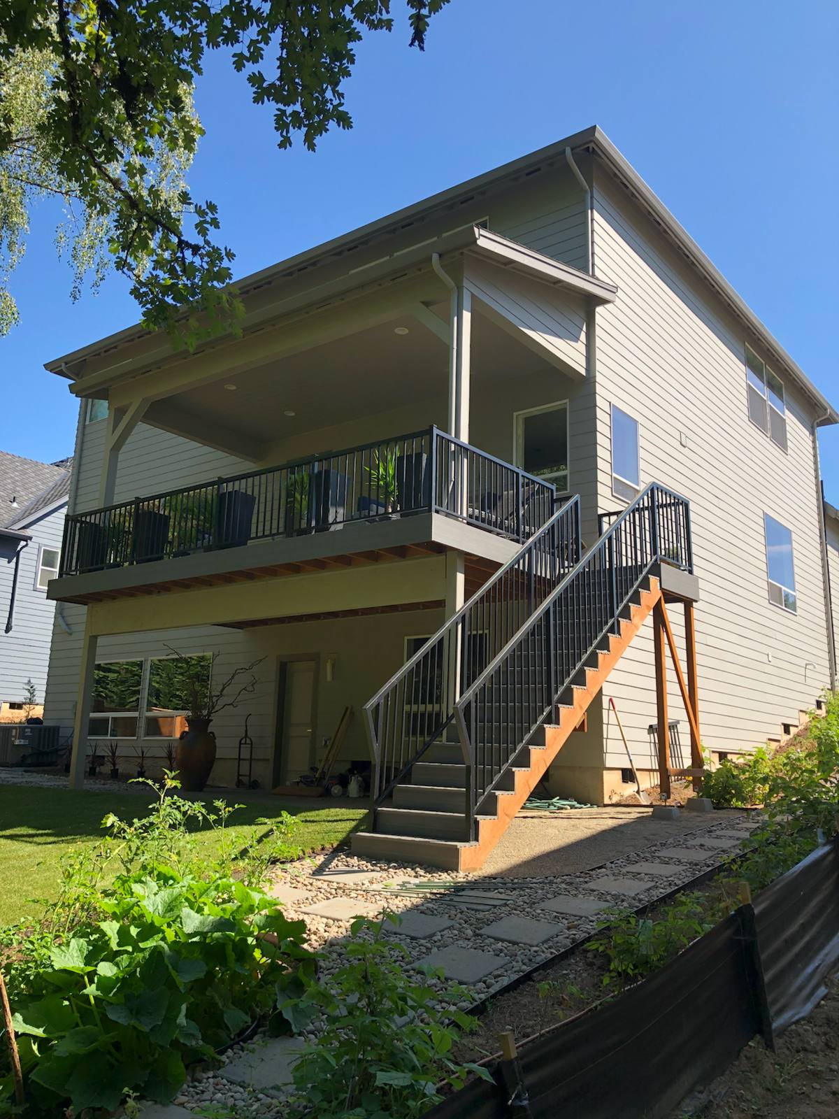 Metal railing on exterior deck stairs in a Portland-area home