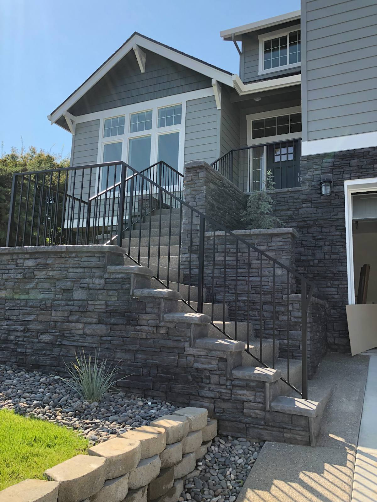 Black metal handrail on concrete front steps — Vancouver, WA area