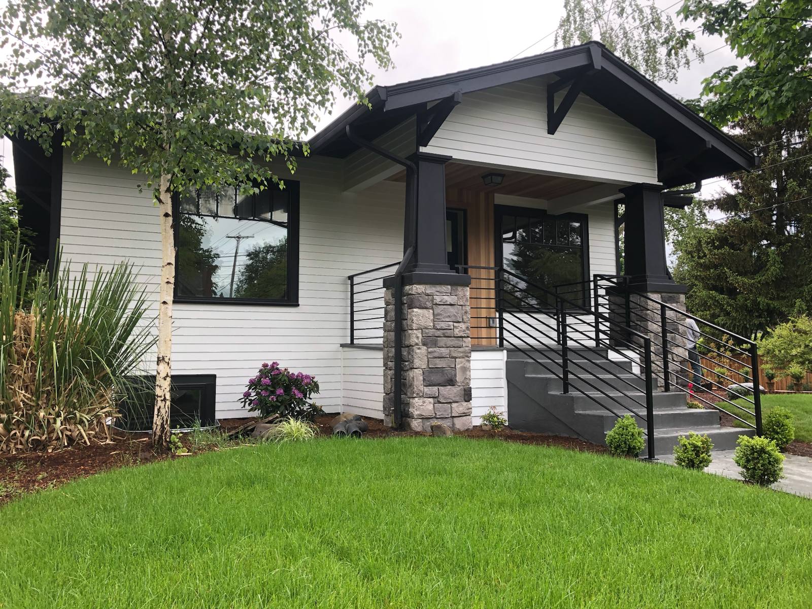 Black metal porch railing and step handrail — Portland, OR