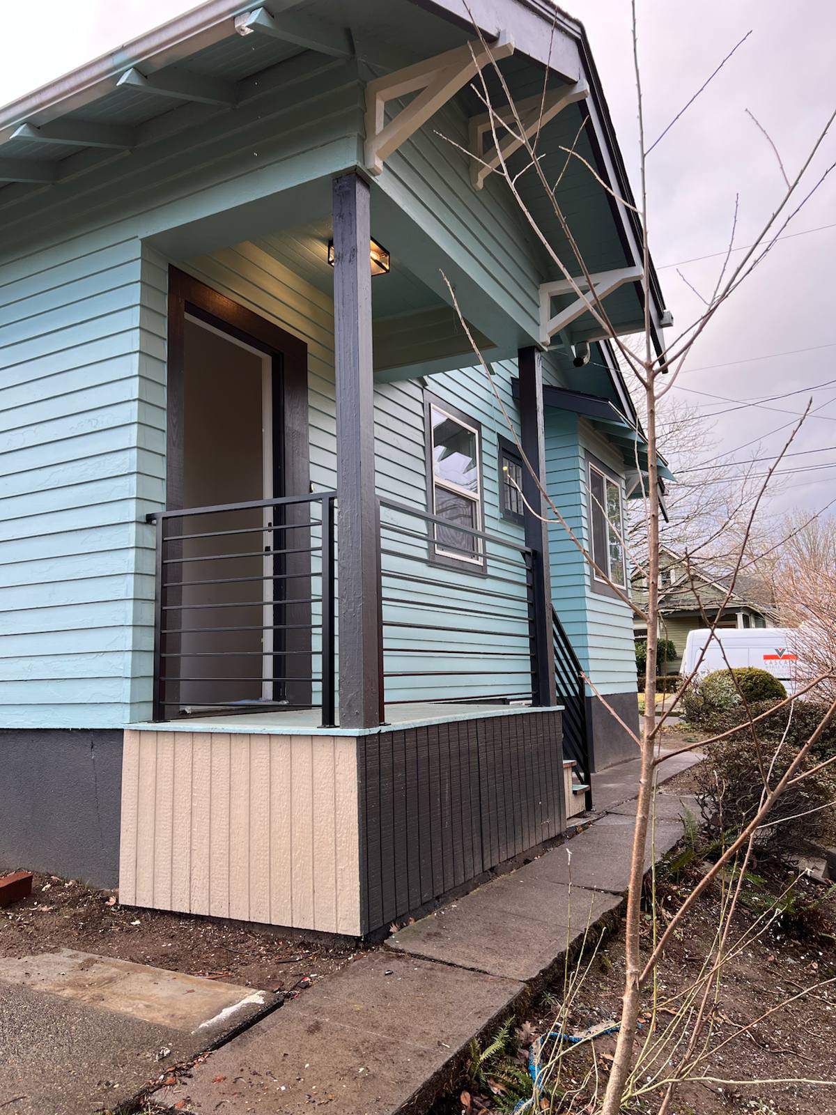 Black metal porch railing and step handrail — Portland, OR