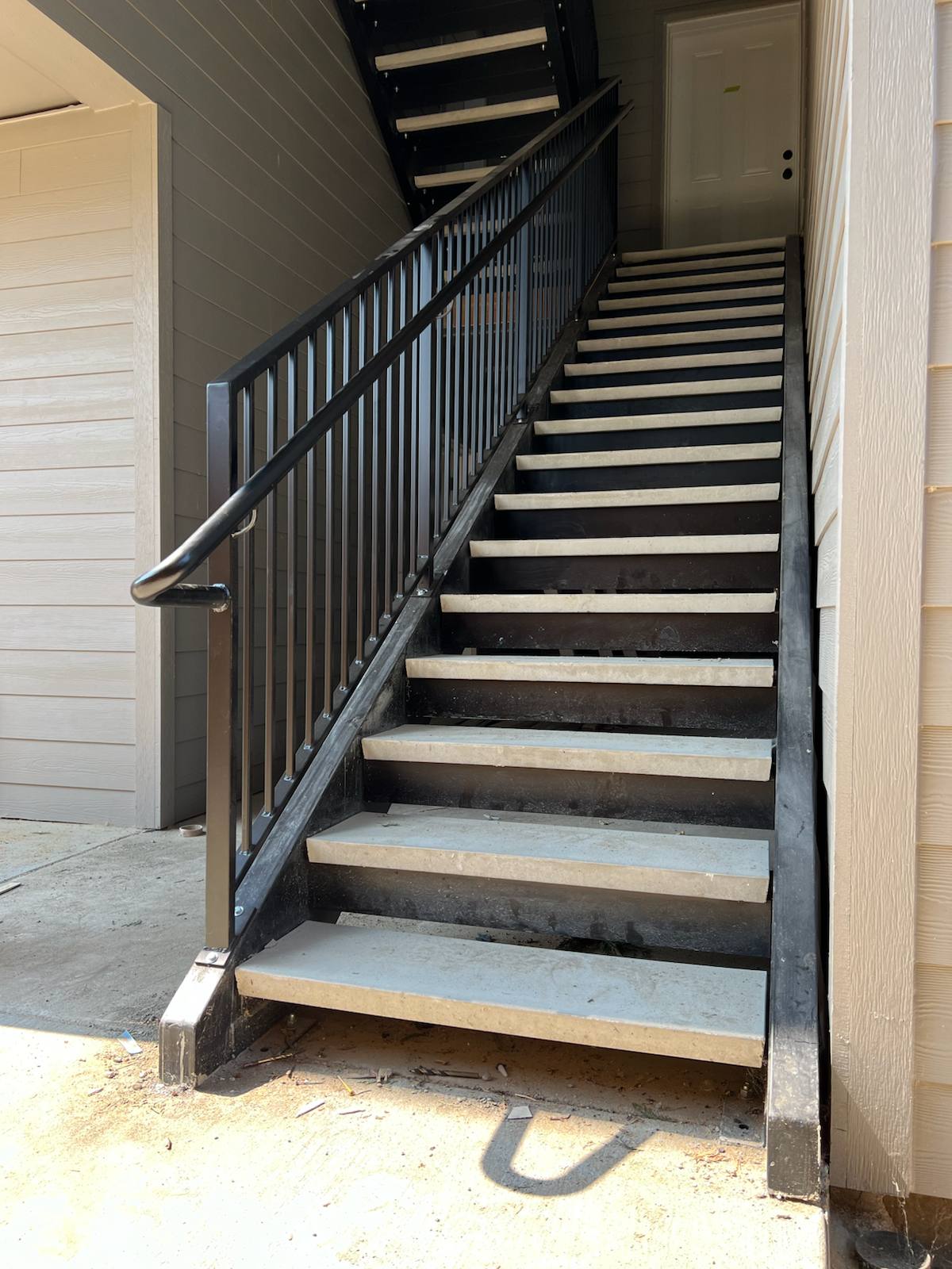 Metal railing on a multi-level exterior staircase — Portland, OR