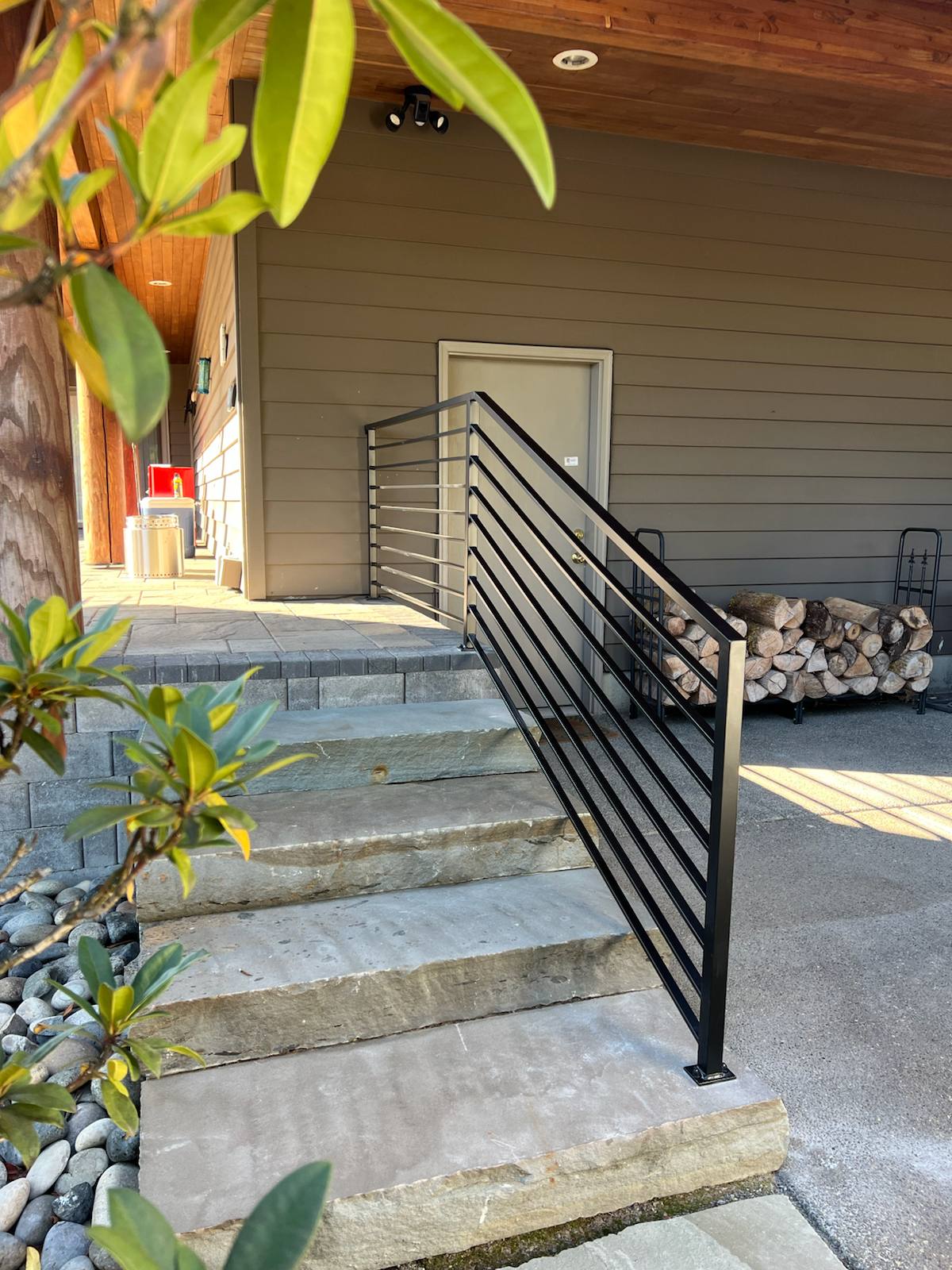 Black metal handrail on concrete front steps — Vancouver, WA area