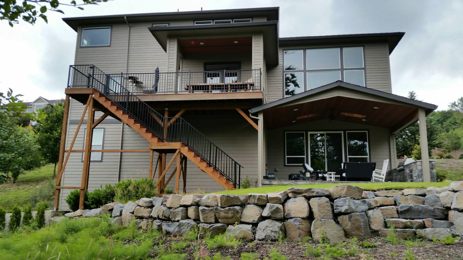 Metal railing on exterior deck stairs in a Portland-area home