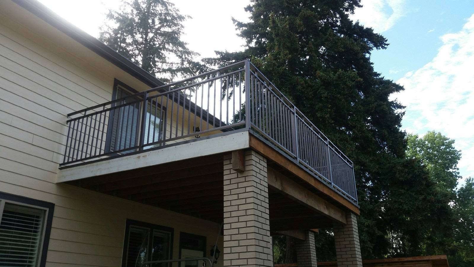Modern metal deck railing on an elevated deck — welded and installed on site